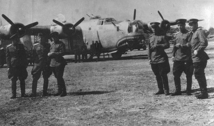 b24 449th BAP Kozlov, Kuzmin, Ugolnikov, Golovanenko. Note American elements of rapid recognition on B-24- checkers on the tail, shark mouth, and remains of the inscription on the nose