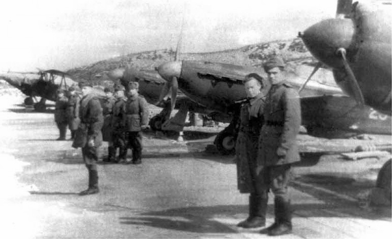 Весной 1945 20 гиап, уже исключенный из действующей армии, перевооружили с иностранной матчасти на отечественную, которую полк получил от 29 гиап (в основном, от других частей, видимо, тоже). 
На это фото попал тот самый Як-1М, который Яковлев лично подарил 2ГСС Покрышеву еще в 1943 г. 
Покрышев поломался на УТИ-4 и ушел командовать 159 иап, а самолет остался. На нем летал командир 29 гиап Дворник. 
После предыдущего командира полка Матвеева сложилось традиции, что командир летает на самолете с б/н как у полка и на Як-1М нарисовали номер 29. Ну а потом вместе с другими Яками передали в 20 гиап.
